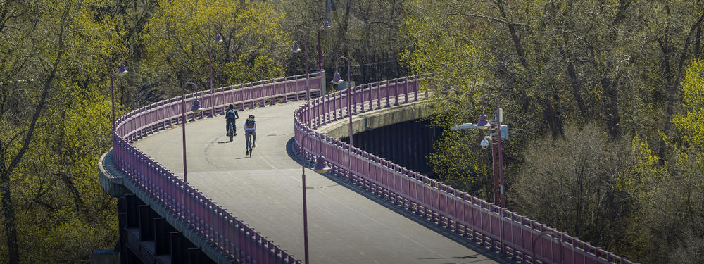 bike commuters on a bridge