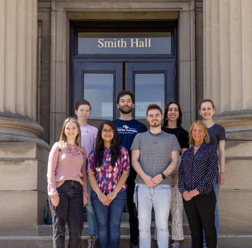 Green chemistry students posing outside Smith Hall